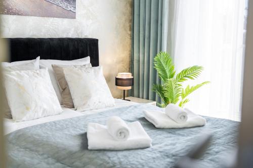 Ένα ή περισσότερα κρεβάτια σε δωμάτιο στο Apartament 208 - by Perłowa Przystań Rent