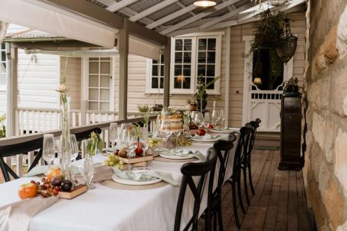 a table set for a meal on a patio at The Rustic Nest Yarramalong in Yarramalong