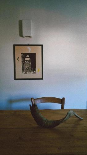 a room with a chair and a picture on the wall at Apartment C-MM09 in Bussi sul Tirino