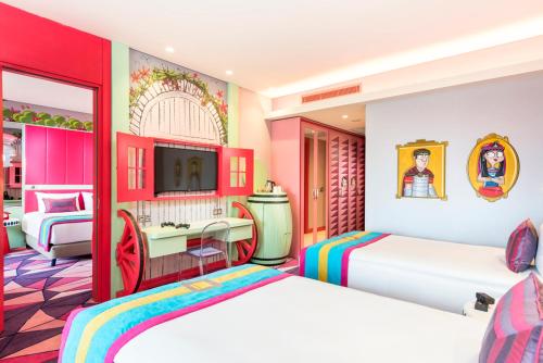 a hotel room with two beds and a bathroom at The Land Of Legends Kingdom Hotel - All-in Concept in Belek
