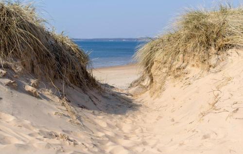 a pair of sand dunes on the beach at Lovely Home In Heberg With Wifi in Heberg