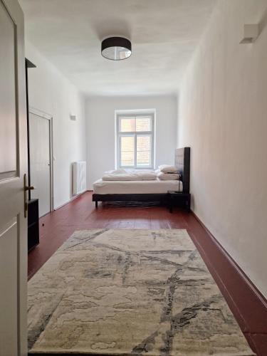 a bedroom with a bed and a large rug at Altstadt Idylle Bad Radkersburg in Bad Radkersburg