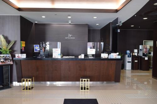 a store with a cash counter in a mall at Hotel Resh Tottori Ekimae in Tottori