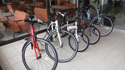three bikes parked next to each other in a store at Hotel Resh Tottori Ekimae in Tottori
