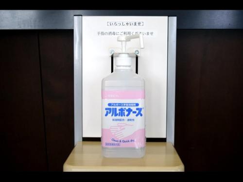 a bottle of soap is sitting on a table at Hotel Resh Tottori Ekimae in Tottori