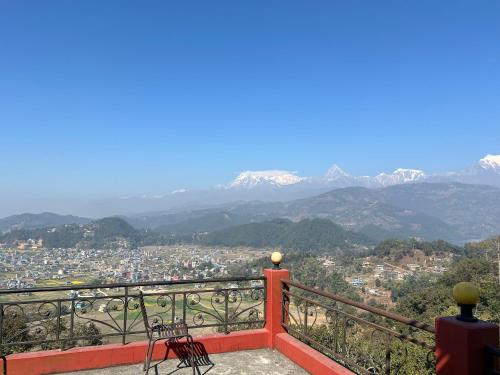 a balcony with a view of a city and mountains at Hotel Lekhnath View Tower and Eco Farm in Deorāli