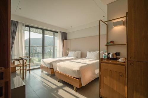 Ένα ή περισσότερα κρεβάτια σε δωμάτιο στο A'dor Hotel & Spa Quy Nhơn