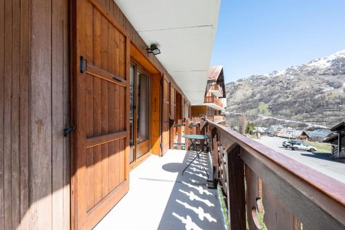 a balcony of a building with a view of a mountain at Les arolles in Valloire
