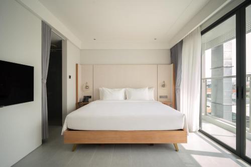Ένα ή περισσότερα κρεβάτια σε δωμάτιο στο A'dor Hotel & Spa Quy Nhơn