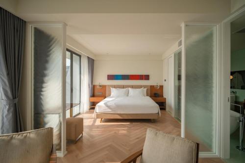 Ένα ή περισσότερα κρεβάτια σε δωμάτιο στο A'dor Hotel & Spa Quy Nhơn