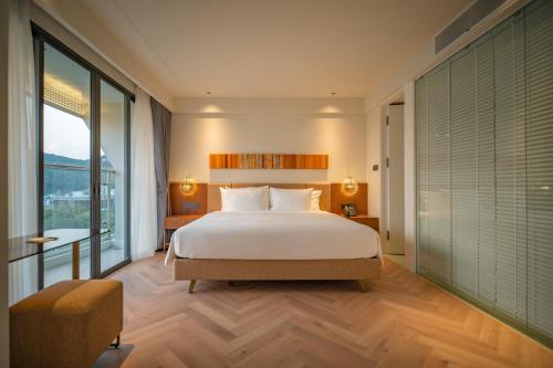 Ένα ή περισσότερα κρεβάτια σε δωμάτιο στο A'dor Hotel & Spa Quy Nhơn