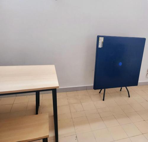 a table and a blue board in a room at Amazing Petaling Jaya Corner Landed Home Paradigm Mall, 5 Bedroom for up to 18Pax, LDP, Kelana Jaya, Paradigm Mall in Petaling Jaya