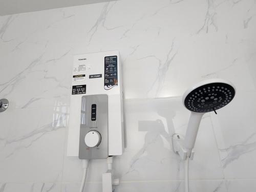a white bathroom with a hair dryer and a comb at Amazing Petaling Jaya Corner Landed Home Paradigm Mall, 5 Bedroom for up to 18Pax, LDP, Kelana Jaya, Paradigm Mall in Petaling Jaya
