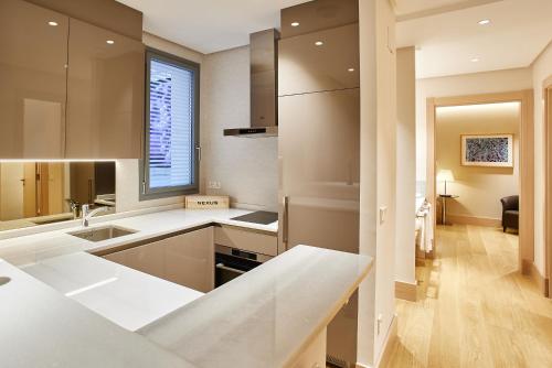 Ένα μπάνιο στο Nexus Santa María Luxury Apartamentos