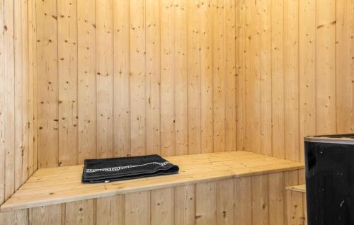 a black book sitting on a shelf in a sauna at Marina Fiskenæs Feriepark in Gråsten
