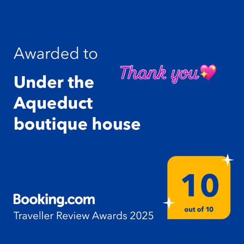 a yellow box with the words awarded to under the house at Under the Aqueduct boutique house in Kavala