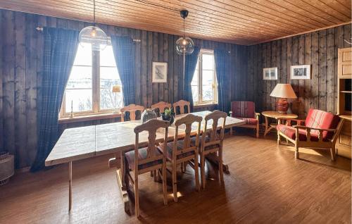 a dining room with a table and chairs at Awesome Apartment In Rauland in Rauland