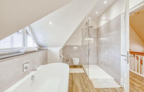 a white bathroom with a shower and a toilet at 3 Bedroom Stunning Home In Sittensen Kalbe in Kalbe