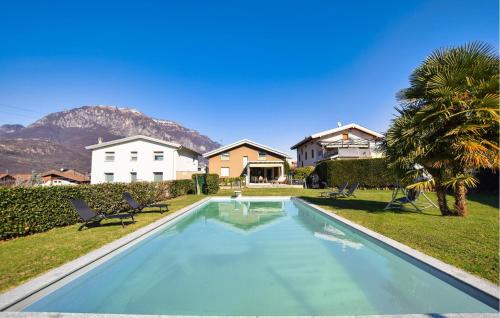 a swimming pool in the yard of a house at Gorgeous Home In Gianico in Artogne