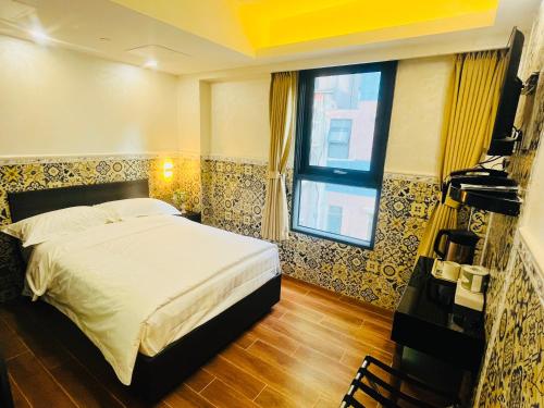 Postel nebo postele na pokoji v ubytování Hou Kong Boutique Hostel