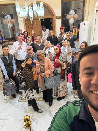 a group of people posing for a picture at Turon Khiva in Khiva