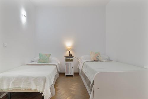 Postel nebo postele na pokoji v ubytování Casa Palacios Conil de la Frontera