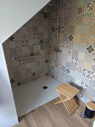 a bathroom with a shower and a wooden table at Quinta da Sra Marocas in Covilhã