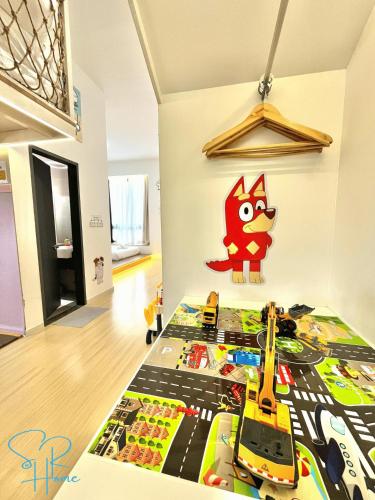 a childs bedroom with a lego toy train on the bed at Sunway GRID by SR Home in Kampong Pendas