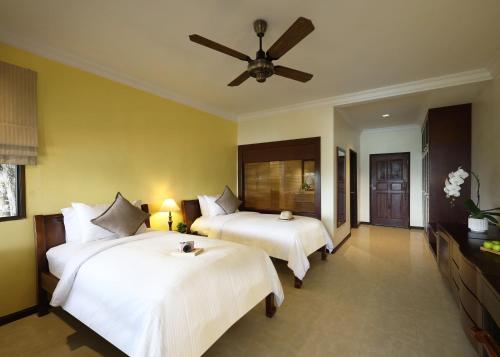 Postel nebo postele na pokoji v ubytování Berjaya Langkawi Resort