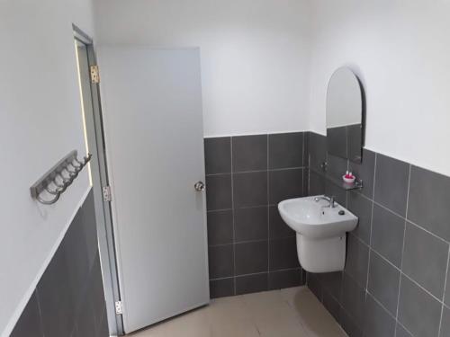 a bathroom with a sink and a mirror at Carpe Diem Guest House in Ko Chang