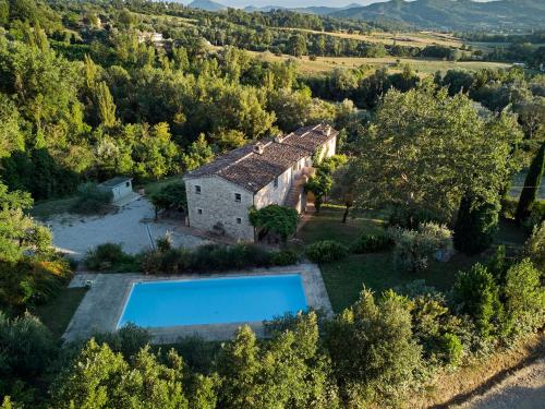 an aerial view of a house with a swimming pool at Villa Bacciana in Montone