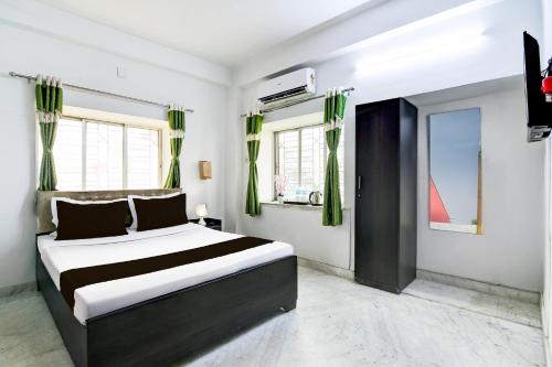 Ένα ή περισσότερα κρεβάτια σε δωμάτιο στο Hotel O Anandapur Near Annapurna Garden