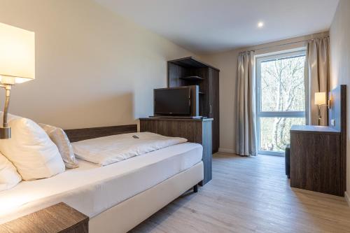 Postel nebo postele na pokoji v ubytování Lille Hus 3