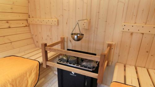 a small room with a bed and a bucket at Hakone Fuga - Adult Only in Hakone