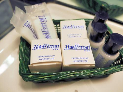 a basket filled with toiletries on a table at Hotel Ferrari in Chiavari