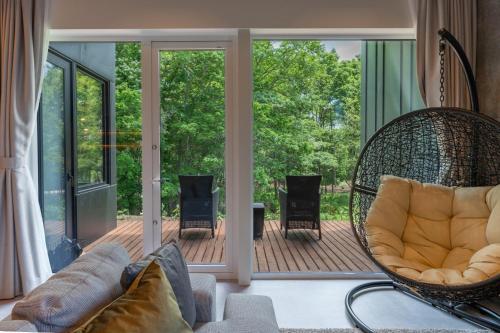 a living room with a porch with a swing at L&R RUSUTSU - Vacation STAY 05019v in Kimobetsu