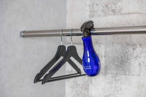 a blue toothbrush is hanging from a towel rack at L&R RUSUTSU - Vacation STAY 05019v in Kimobetsu