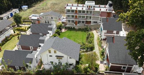 an aerial view of a house in a residential neighborhood at Megha Resort & Villas, Dehradun-Where Nature Pampers You in Dehradun