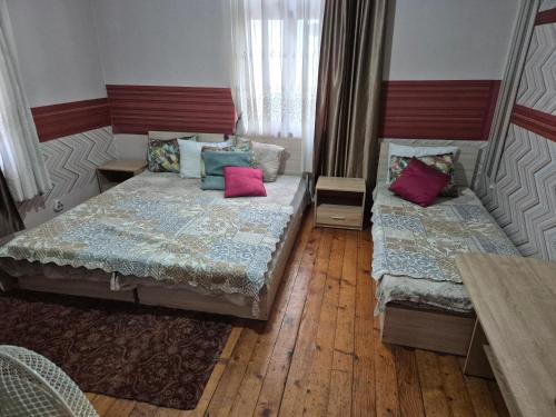 a bedroom with two beds with pillows on them at Hostel Alex 1 in Sofia