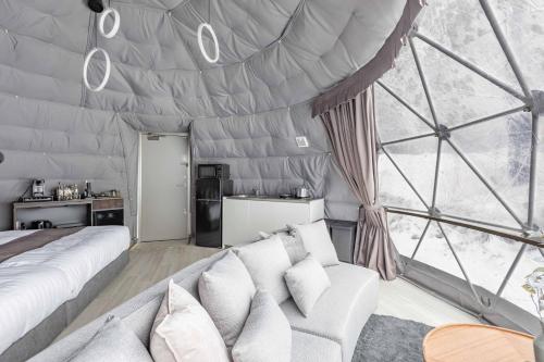 a room with a bed and a large window at L&R RUSUTSU - Vacation STAY 67508v in Kimobetsu