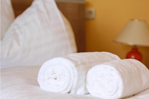 Cama o camas de una habitación en Apartmenthotel Karawankenblick