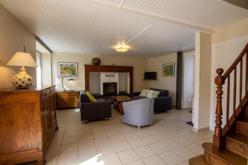 a living room with a couch and a table at Gite brisset in Coulaures