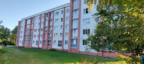 a large apartment building with red and white at Designer Apartment in Roja