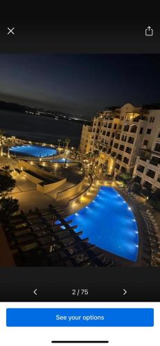 a picture of a swimming pool in a hotel at Samarah Resort D27 Families only in Sowayma