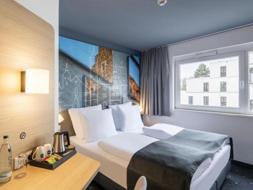 Postel nebo postele na pokoji v ubytování B&B Hotel Schweinfurt-City