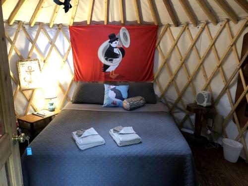 a bedroom with a bed in a yurt at Alaskan Yurt Glamping, Perfect for a Couples Getaway in Seward