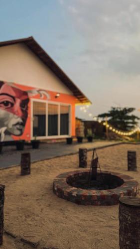a building with a painting on the side of it at Beach House Varkala by Palmyra in Varkala