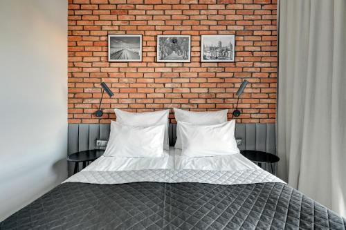 Ένα ή περισσότερα κρεβάτια σε δωμάτιο στο Nowa Motława SPA, Pool, Gym by Downtown Apartments