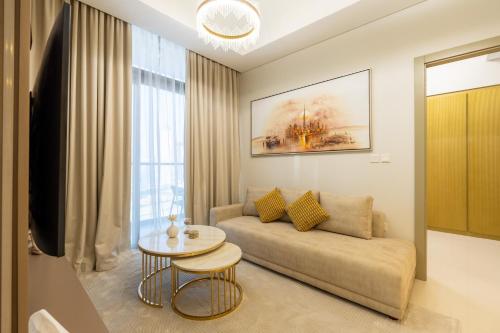 a living room with a couch and a table at Keyrock Aykon Tower, Business Bay - Pool & Gym in Dubai