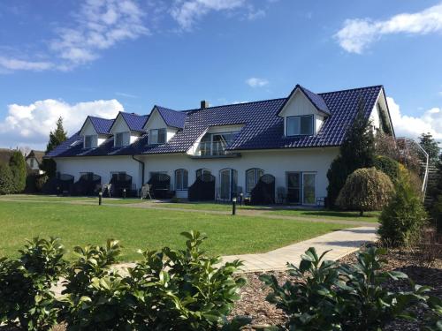 Taman di luar Appartementanlage Zur Seemöwe